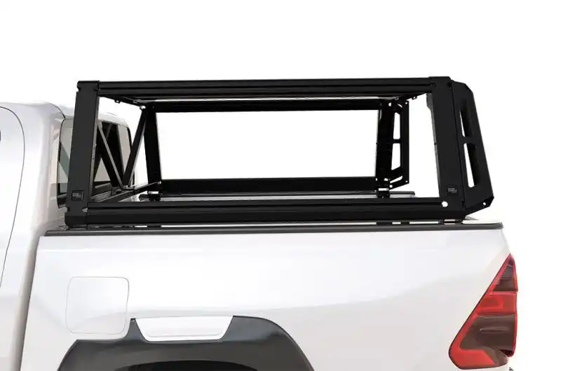 Toyota Hilux Revo Double Cab (2016-Current)  Pro Bed System - This tough, lightweight steel and aluminum system secures to the load bed of your Toyota Hilux Revo Double Cab, thereby hugely increasing its gear-carrying capacity. This Pro Bed System is designed to fit a Front Runner rack and several accessories to its sides. These include molle panels, storage boxes or recovery tracks. With this cargo-carrying system, you can carry all the gear you need for any adventure.  